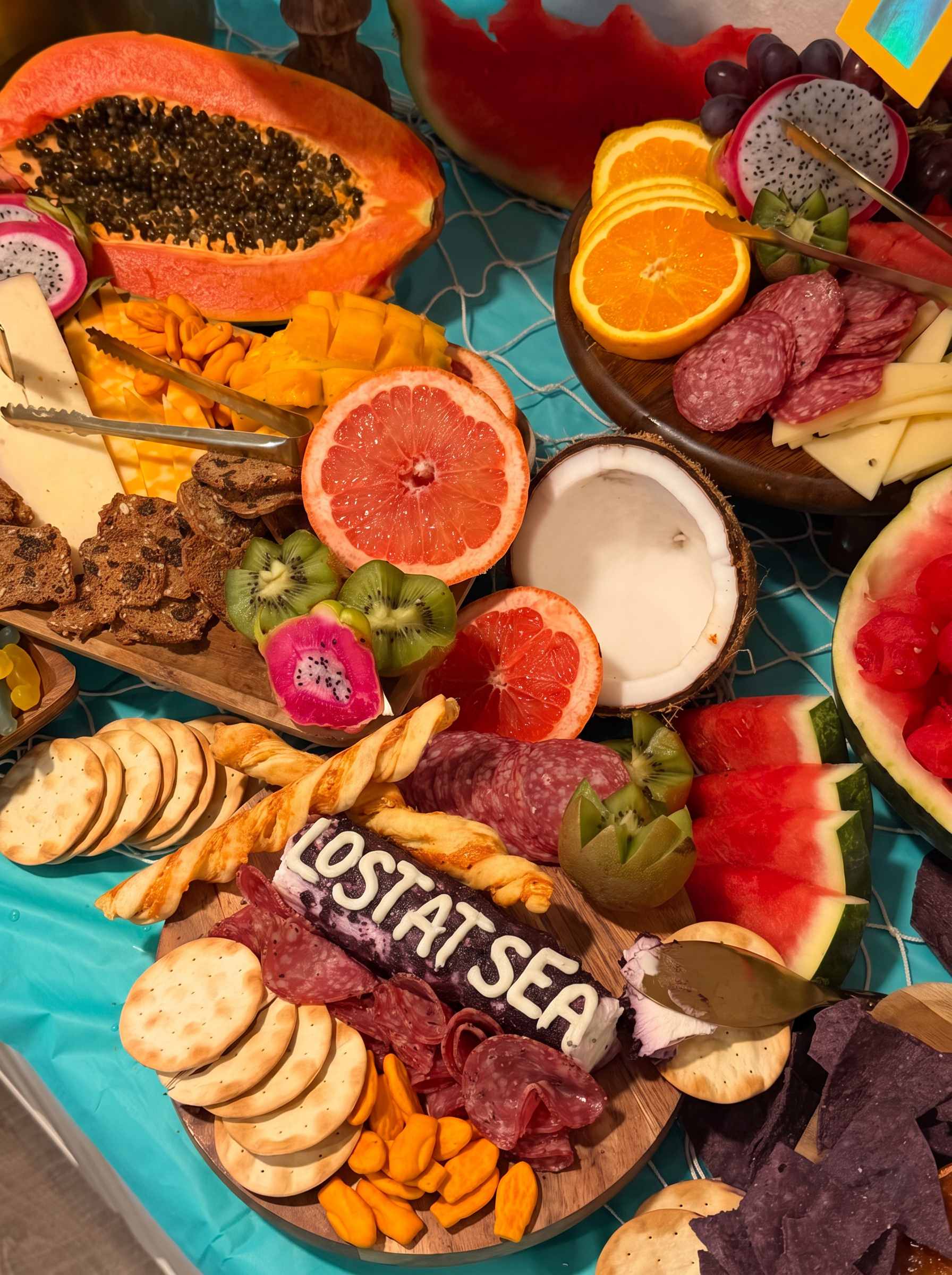 Lost at Sea cheese log surrounded by salami, crackers and citrus