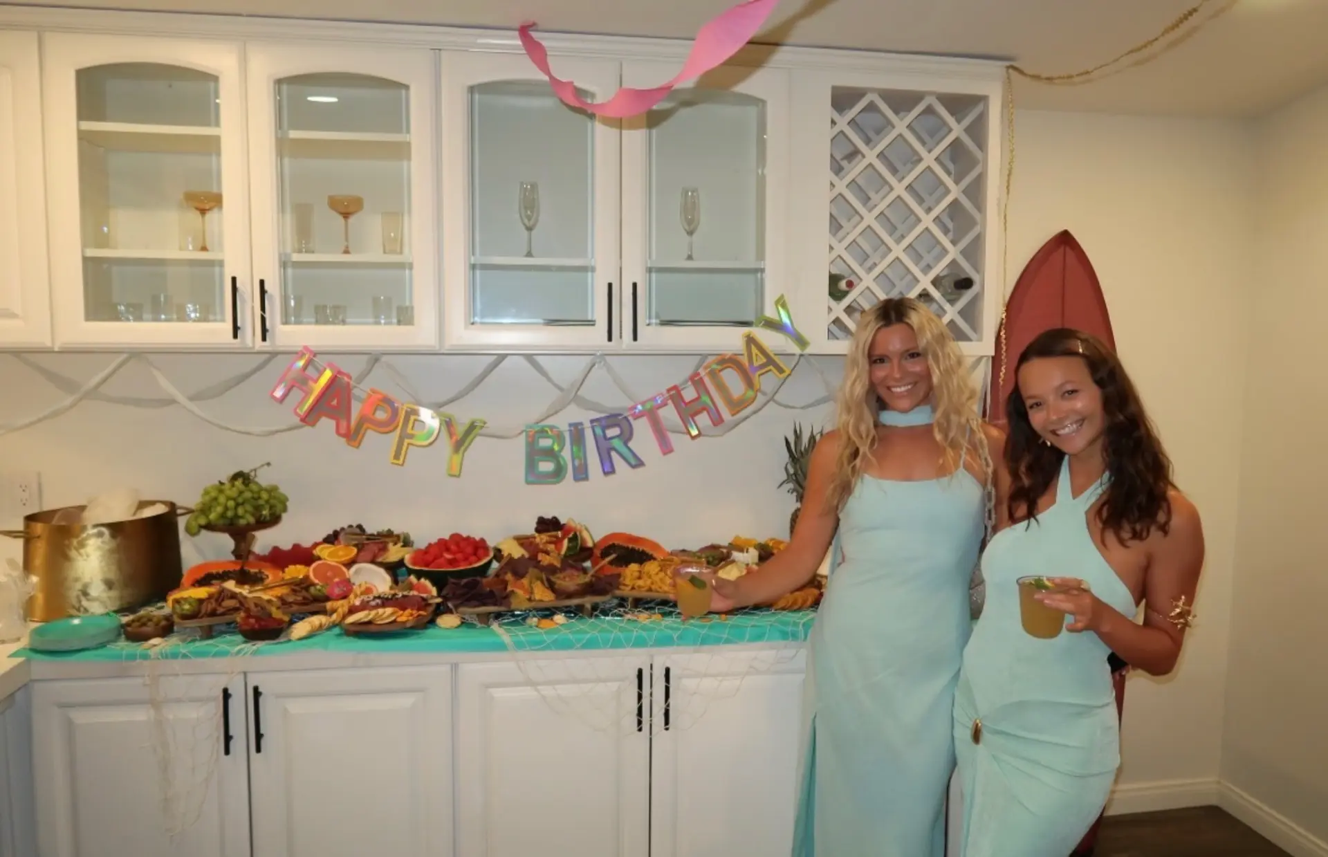 Taylor and Shelby standing together in front of a grazing table